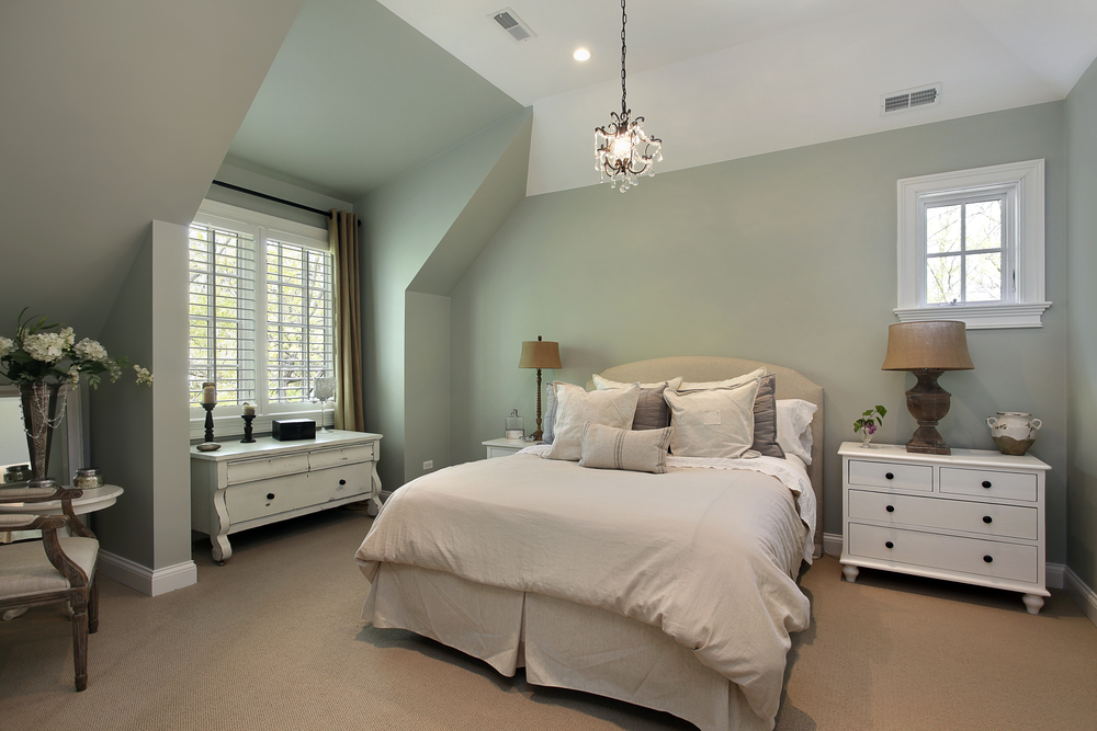 Guest room: bedside lamps, wardrobe, bedside table with towels.