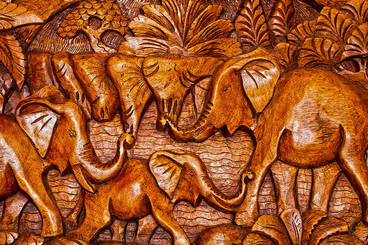 Decorate with wood carvings and textiles.