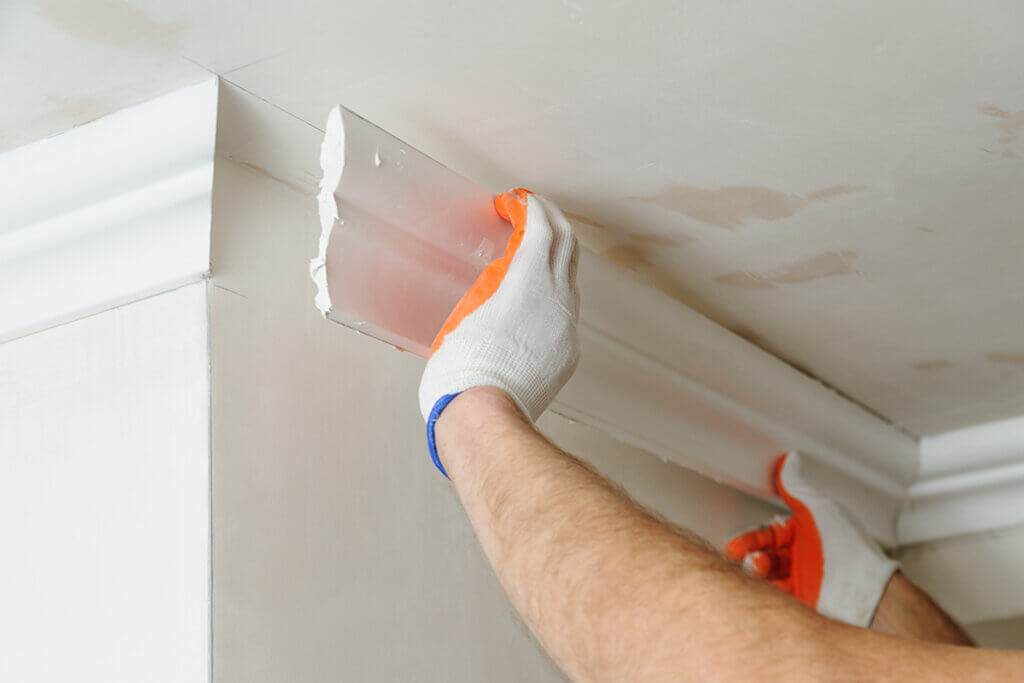 Crown moldings are ideal for covering pipes that protrude from high areas.