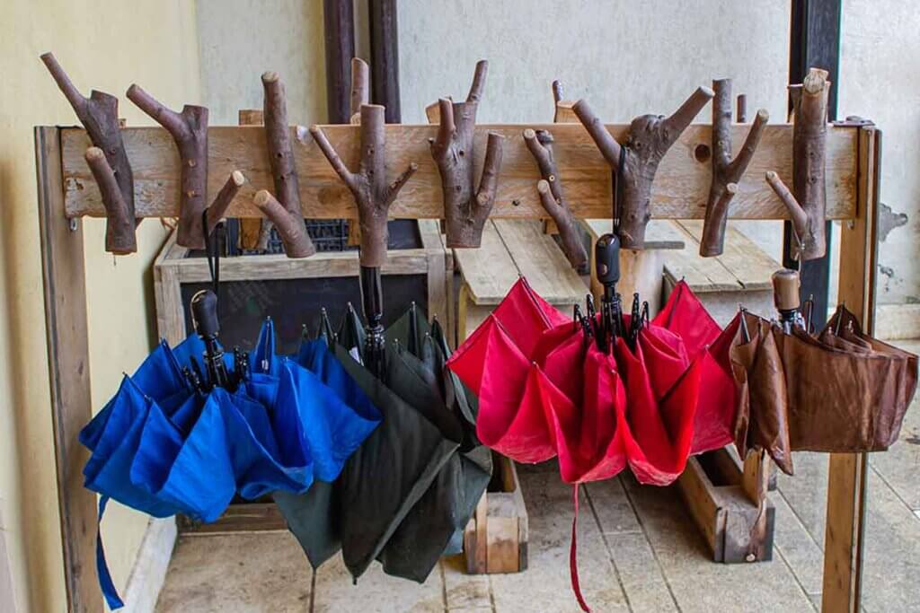 Create some amazing coat racks with logs and branches.